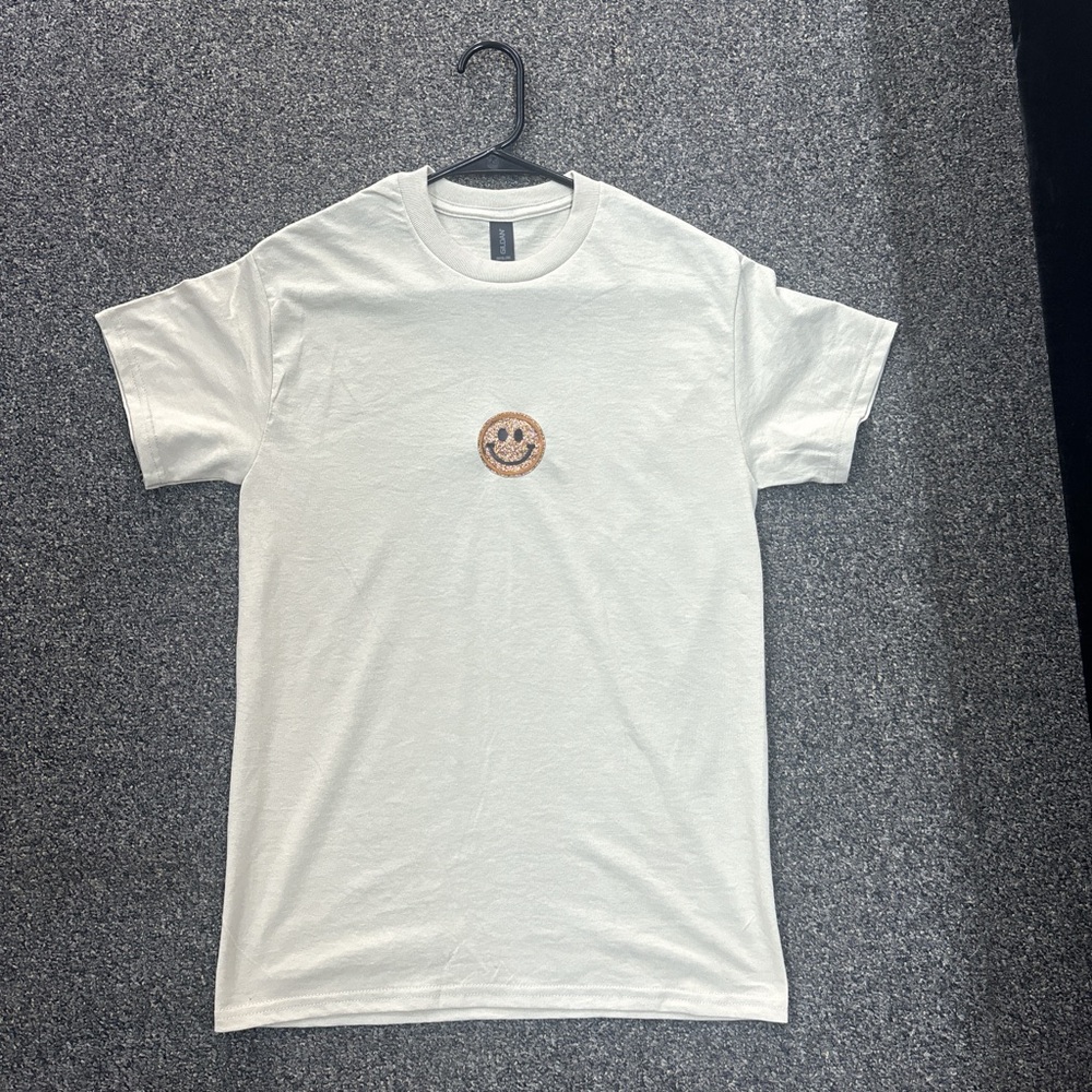 Cream color cotton t-shirt withh smile face on it ( small)